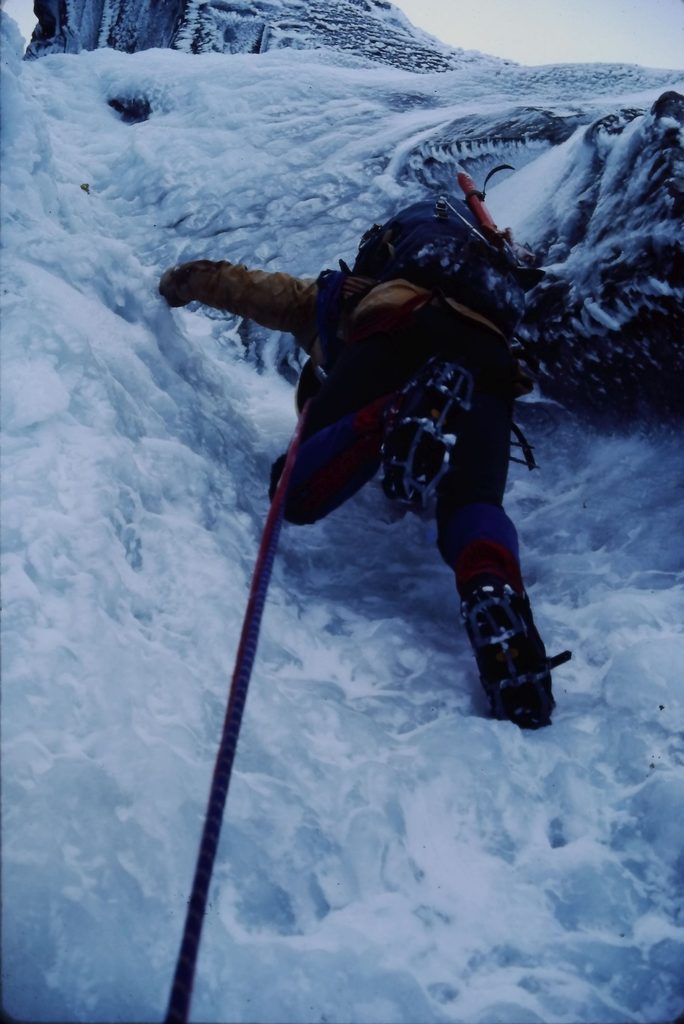 Tony grappling with the steep ice on the crux of Point Five Gully.