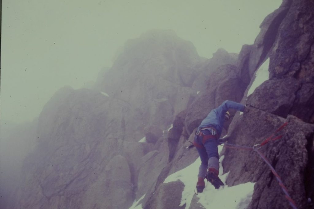Steve scrambling to the summit of Batiaan