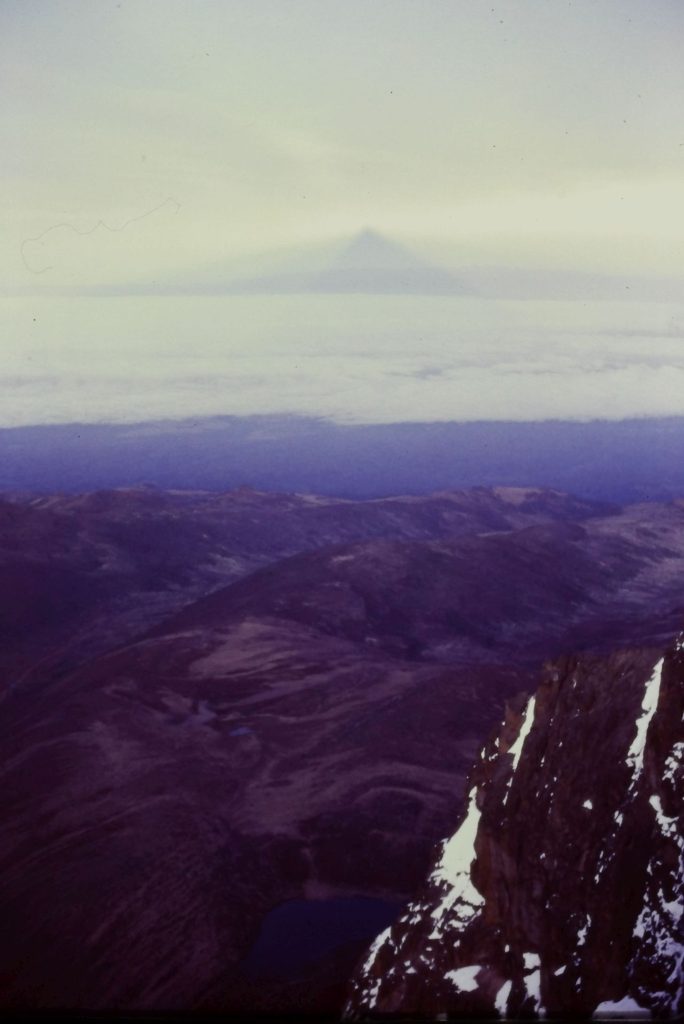 Darklight - Mt Kenya's shadow torch beam projected across the savannah's cloud deck at dawn