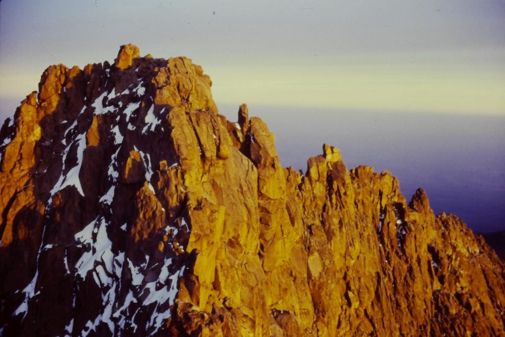 Batiaan summit at sunrise after climbing Ice Window route. Viewed from Nelion